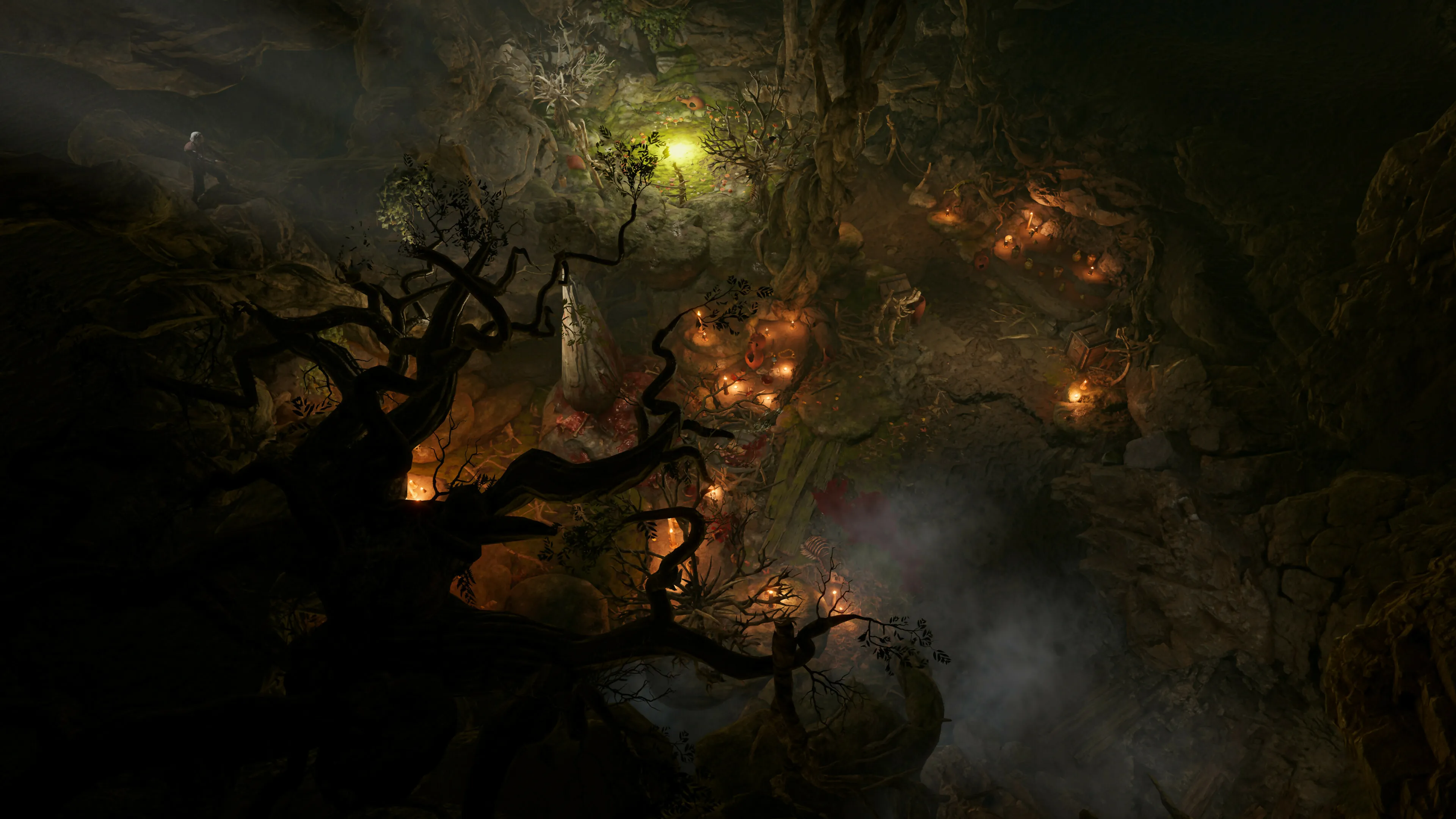 Top-down isometric view of a dim cavern grotto with twisted ancient trees, glowing candles around an altar, and a green subterranean pool